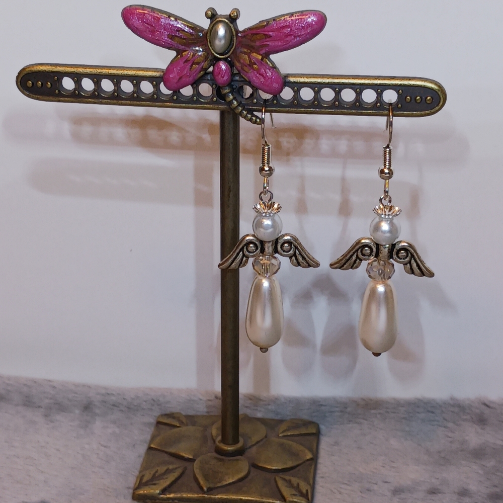 Earrings: Ivory tear drop pearl  Angel on silver earwires.